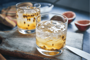 Two Passion Fruit Caipirinhas side by side