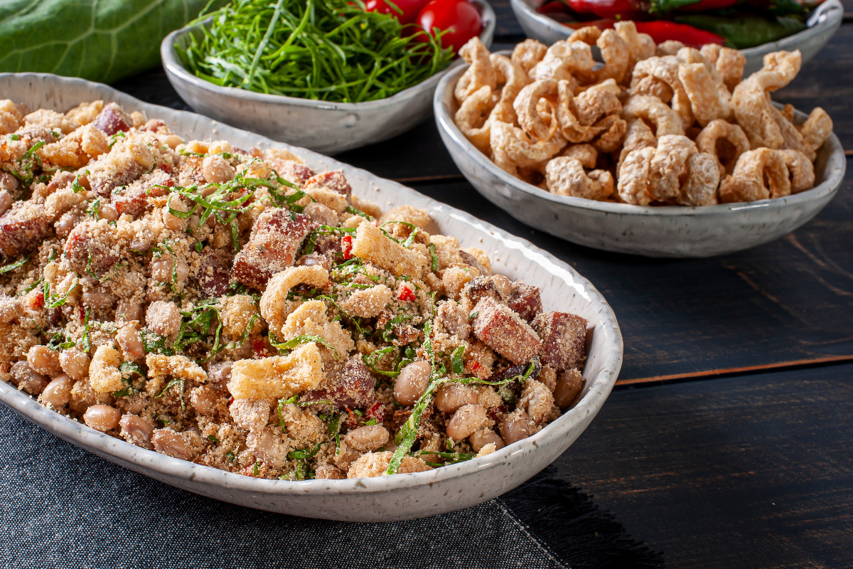 Brazilian feijao tropeiro in white casserole dish