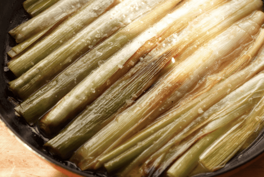 braised leeks in a pan